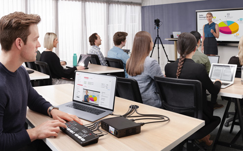 Person live streaming footage from a classroom